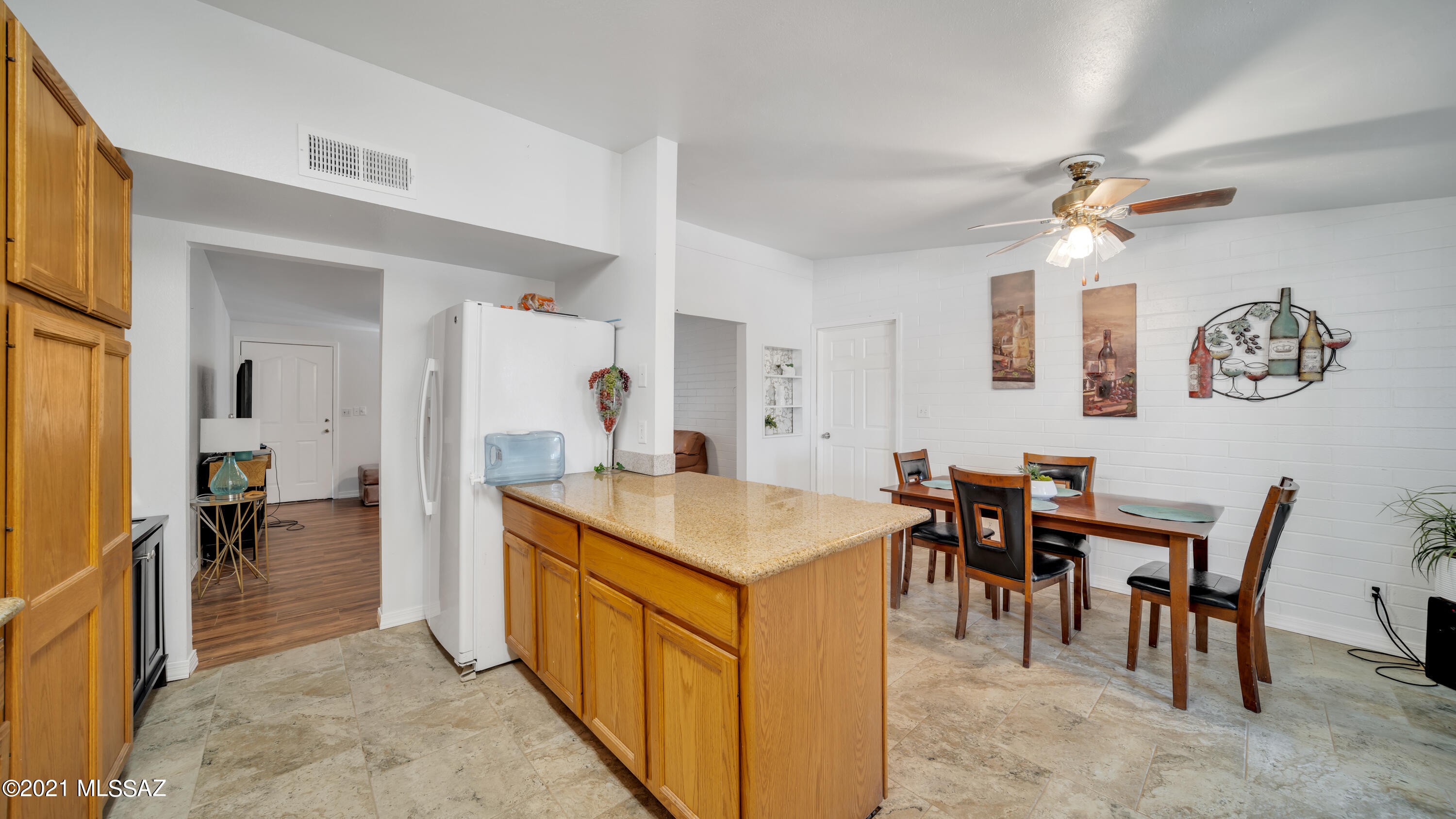1850 West Saxony Road Tucson, AZ 85713 - Photo 6 of 33 a dining hall with stainless steel appliances granite countertop a dining table and chairs