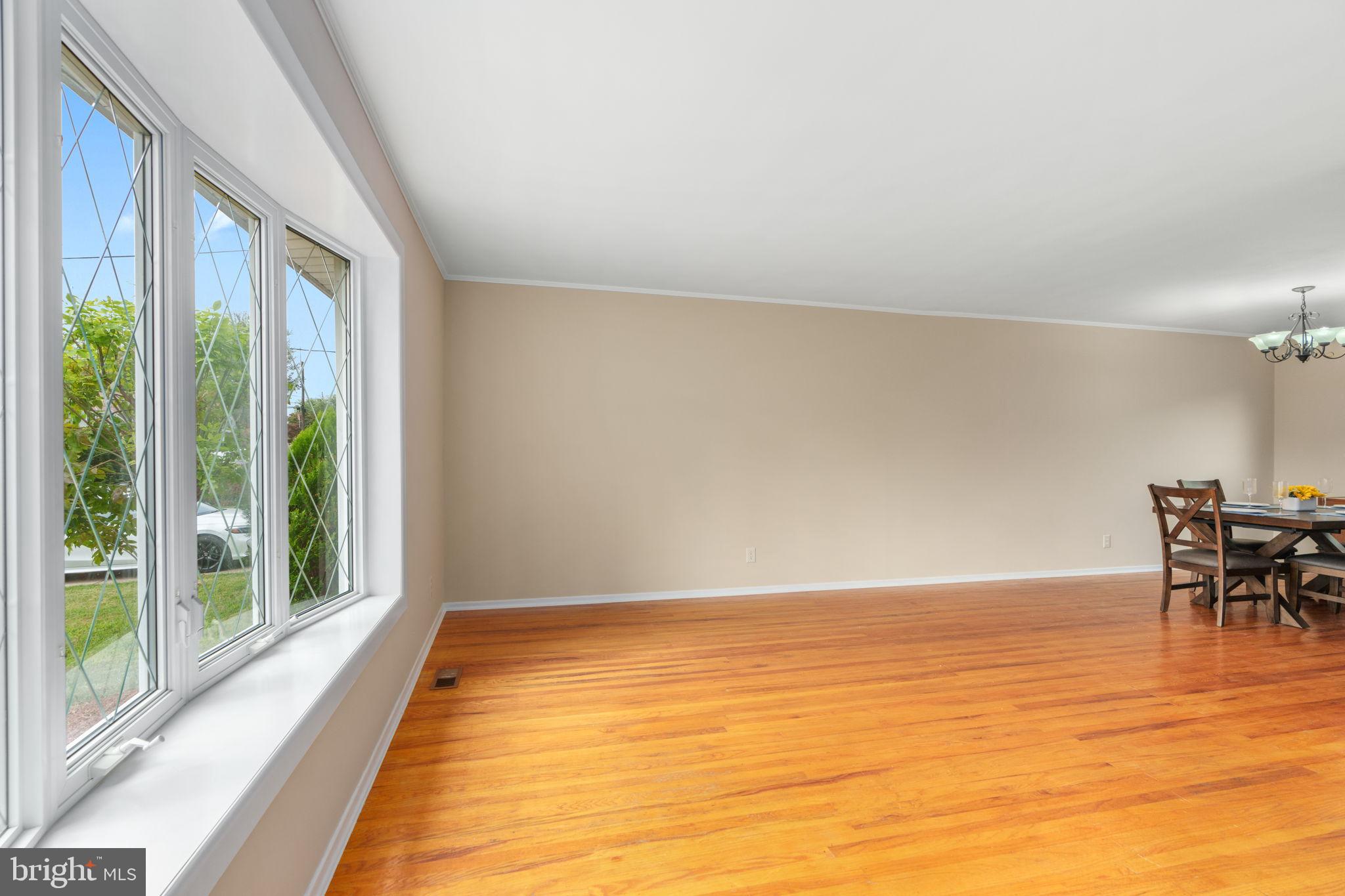 1001 Mueller Road Warminster, PA 18974 - Photo 8 of 39 Spacious living room with gleaming wood floors.