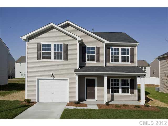 2211 Durand Road, Unit 77 Fort Mill, SC 29715 - Photo 1 of 16 a front view of a house with a yard