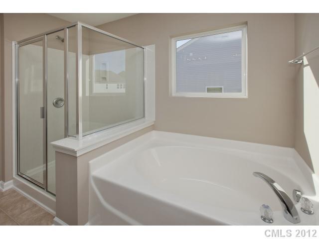 2211 Durand Road, Unit 77 Fort Mill, SC 29715 - Photo 15 of 16 a bathroom with a bathtub and a shower