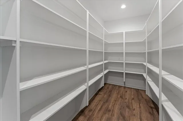 a view of hallway with wooden floor