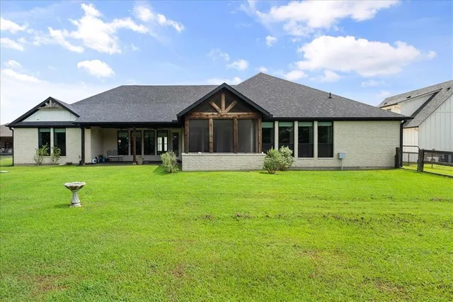 an aerial view of residential houses with outdoor space and swimming pool