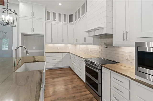 a view of living room kitchen with furniture and fireplace