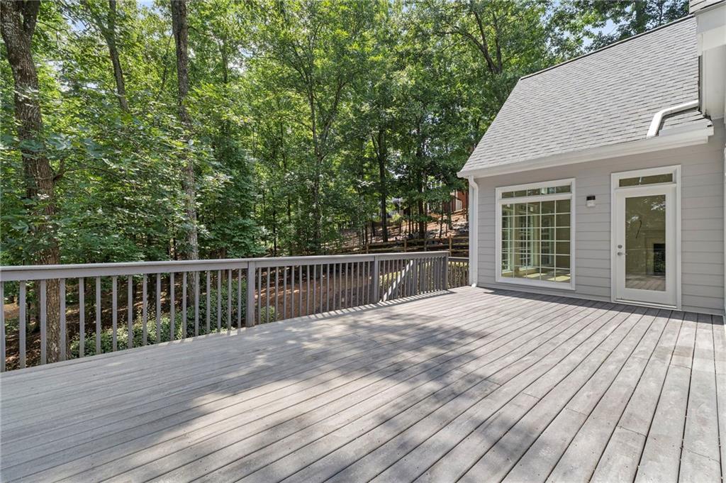 8965 Laurel Way Alpharetta, GA 30022 - Photo 25 of 79 a view of backyard with a deck