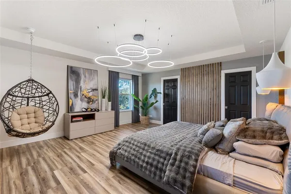 a bedroom with a bed and a dresser