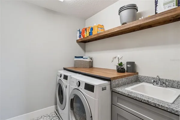 a living room with patio furniture and garden