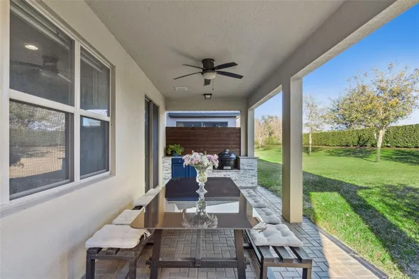a view of a chairs and table in a backyard