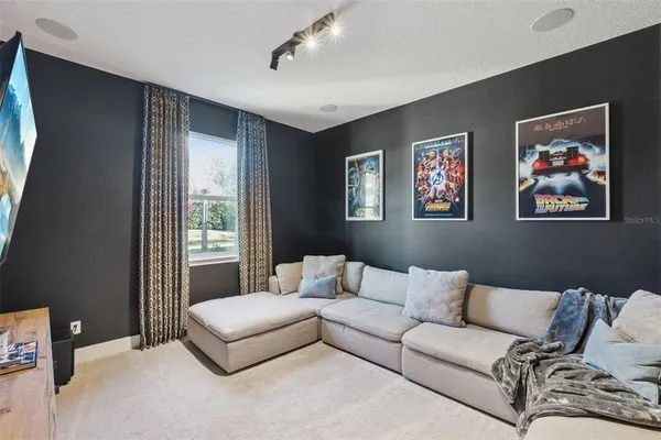 a living room with furniture and a large window