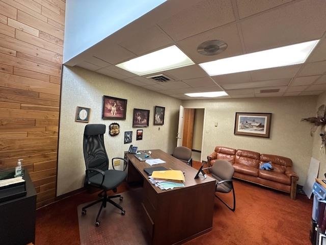 301 Chestnut Street Virginia, MN 55792 - Photo 8 of 31 Office featuring wooden walls, dark carpet, and a paneled ceiling