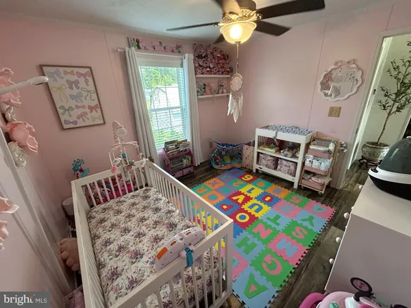 a bedroom with a bed and a small bathroom