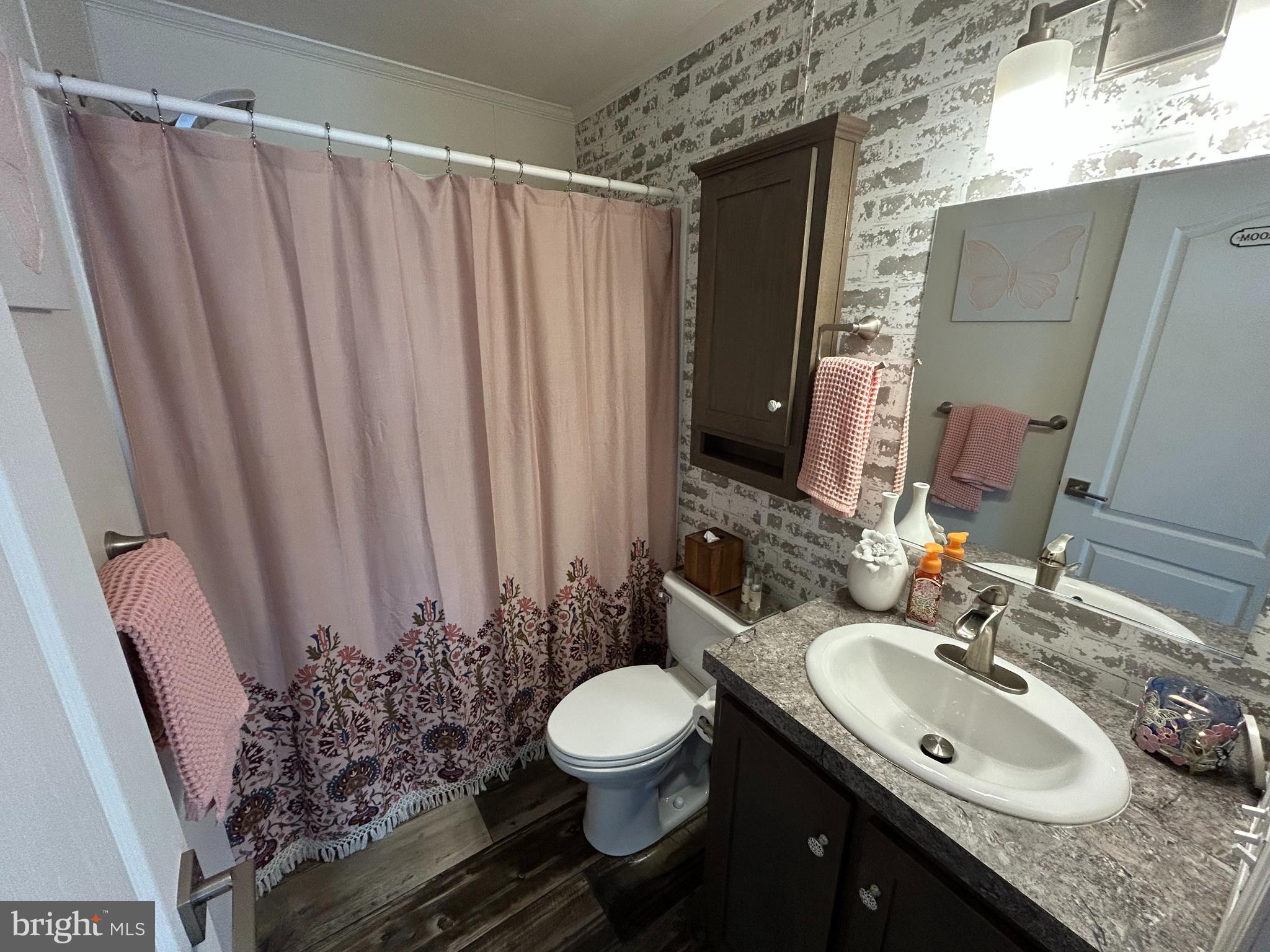 814 North Street Jackson, NJ 08527 - Photo 19 of 19 a bathroom with a granite countertop sink toilet and a mirror