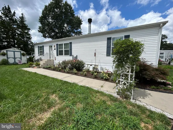 a house view with a garden space