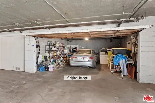 a view of parking garage with cars