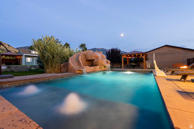 687 South 2080th Street East Springville, UT 84663 - Photo 141 of 149 Outdoor swimming pool featuring a rock-formation water slide and water features