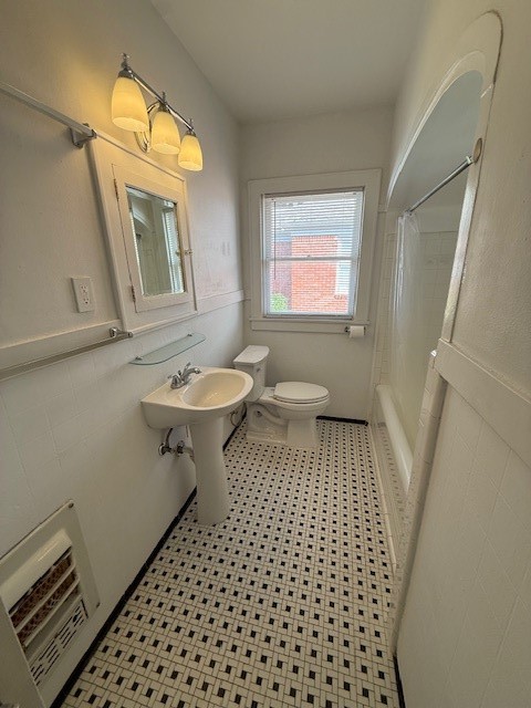 1710 Bolsover Street, Unit 2 Houston, TX 77005 - Photo 13 of 22 a bathroom with a sink and a mirror