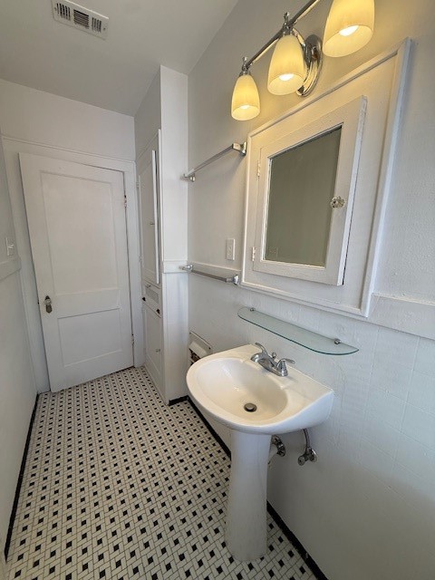 1710 Bolsover Street, Unit 2 Houston, TX 77005 - Photo 14 of 22 a bathroom with a sink and a mirror