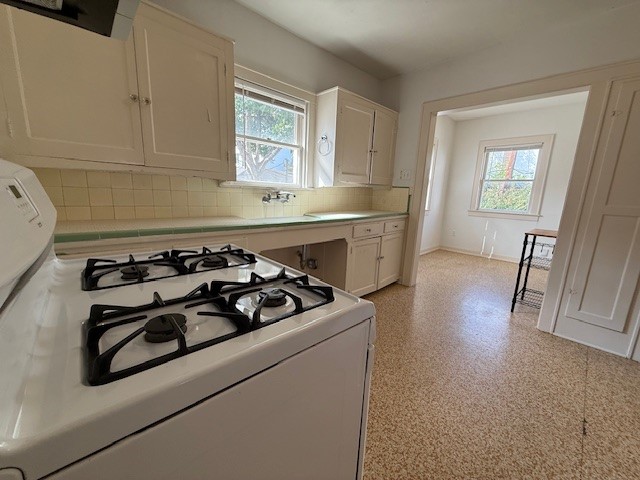 1710 Bolsover Street, Unit 2 Houston, TX 77005 - Photo 8 of 22 a kitchen with a stove a sink and a refrigerator