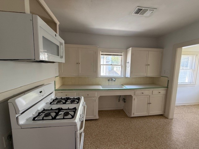 1710 Bolsover Street, Unit 2 Houston, TX 77005 - Photo 9 of 22 a kitchen with sink stove and window