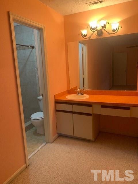 7743 Falcon Rest Circle Raleigh, NC 27615 - Photo 8 of 11 Master bath vanity just off walk in closet.