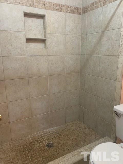 7743 Falcon Rest Circle Raleigh, NC 27615 - Photo 9 of 11 Master shower with ceramic tile.