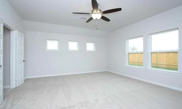 a white toilet sitting next to a white sink