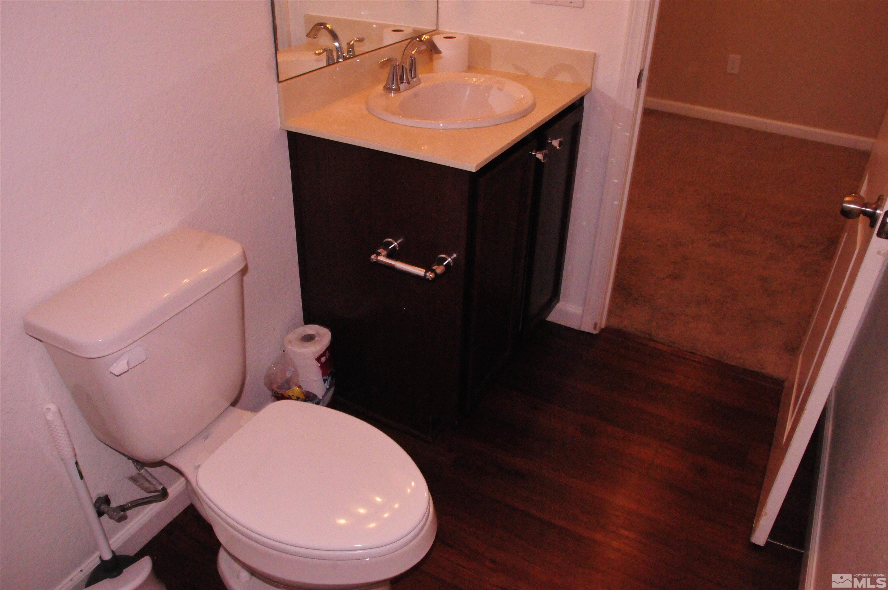9262 Atoll Drive Reno, NV 89506 - Photo 25 of 39 a bathroom with a sink and a toilet