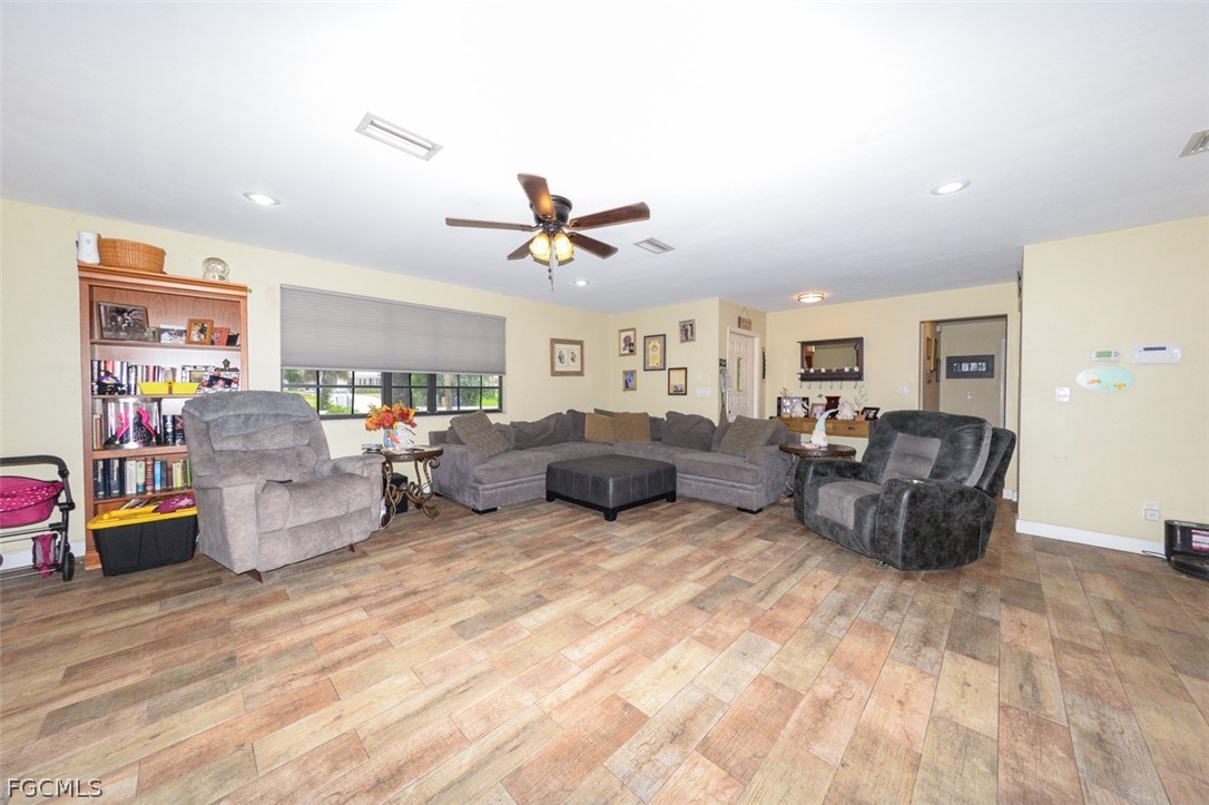 15581 Old Olga Road Alva, FL 33920 - Photo 11 of 38 a living room with furniture and kitchen view
