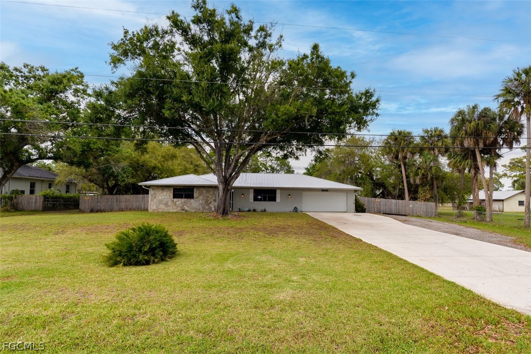 15581 Old Olga Road Alva, FL 33920 - Photo 2 of 38 a house view with a outdoor space