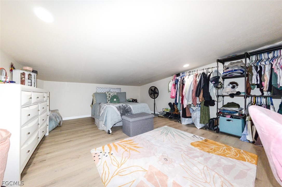 15581 Old Olga Road Alva, FL 33920 - Photo 32 of 38 a bedroom with bed and a large closet
