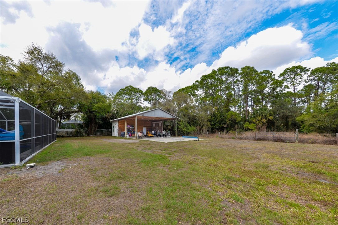 15581 Old Olga Road Alva, FL 33920 - Photo 33 of 38 a view of a house with a yard and basketball court