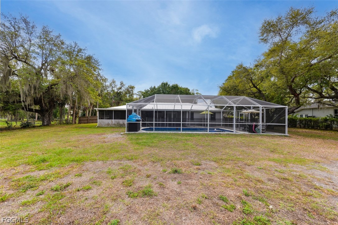15581 Old Olga Road Alva, FL 33920 - Photo 34 of 38 a view of a house with a swimming pool