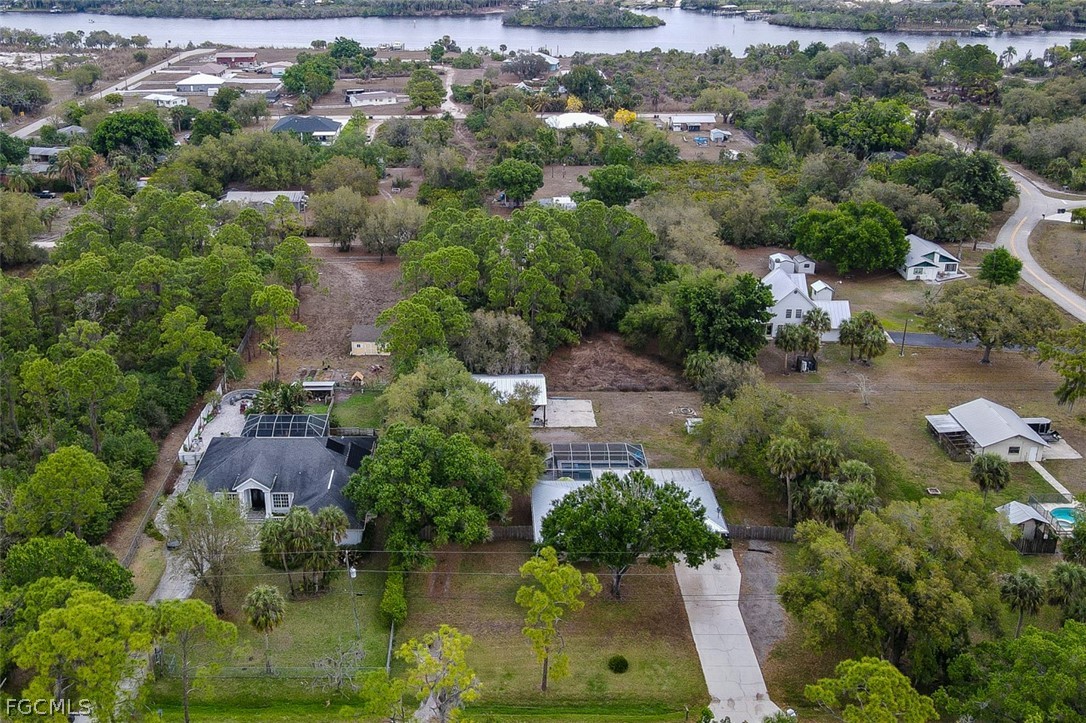 15581 Old Olga Road Alva, FL 33920 - Photo 36 of 38 an aerial view of house with yard swimming pool and outdoor seating