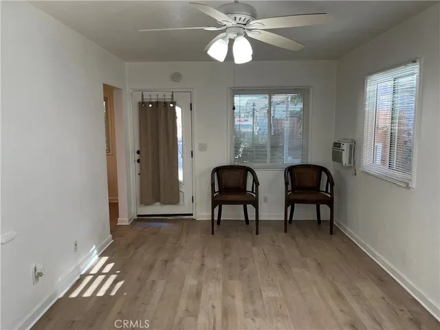 a view of a livingroom with furniture and window