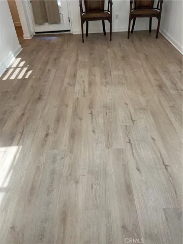 a bathroom with a toilet and a mirror