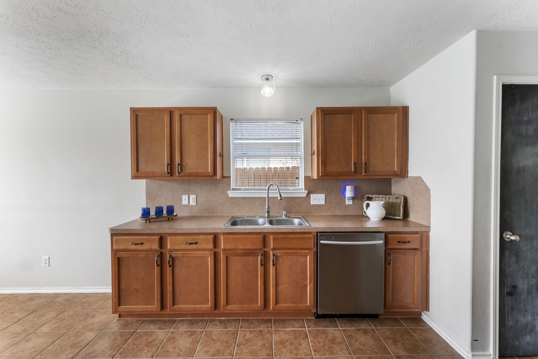 7203 Cool Springs Magnolia, TX 77354 - Photo 12 of 31 a kitchen with a sink and cabinets