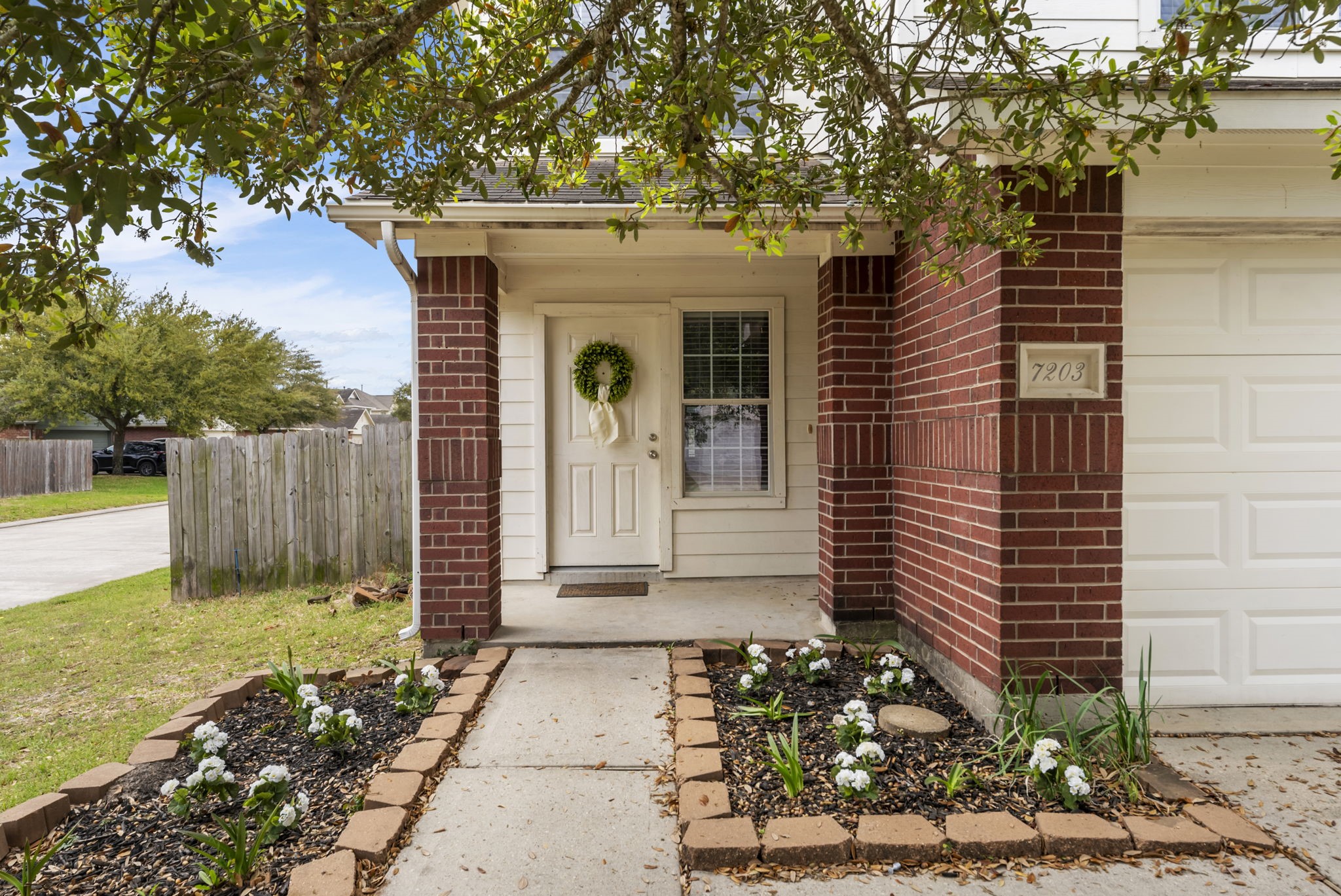 7203 Cool Springs Magnolia, TX 77354 - Photo 2 of 31 a view of a house with a yard
