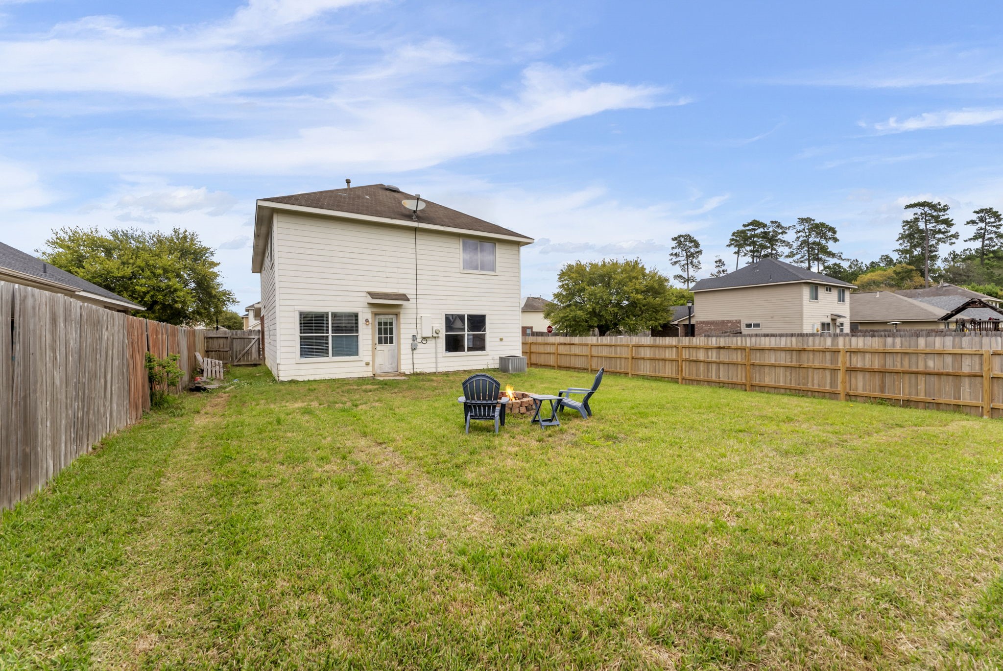 7203 Cool Springs Magnolia, TX 77354 - Photo 28 of 31 a backyard of a house with table and chairs