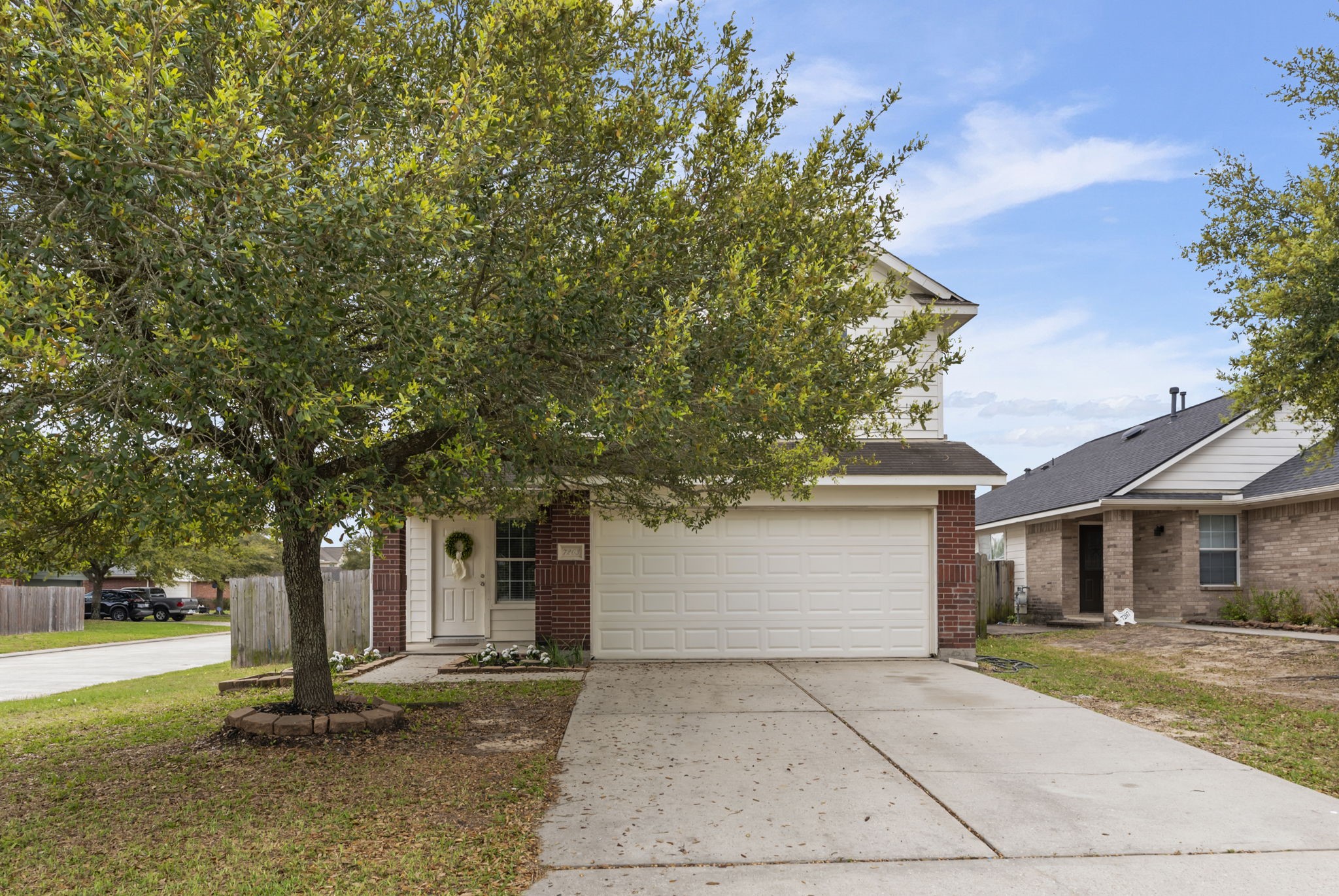 7203 Cool Springs Magnolia, TX 77354 - Photo 30 of 31 a front view of a house with a tree