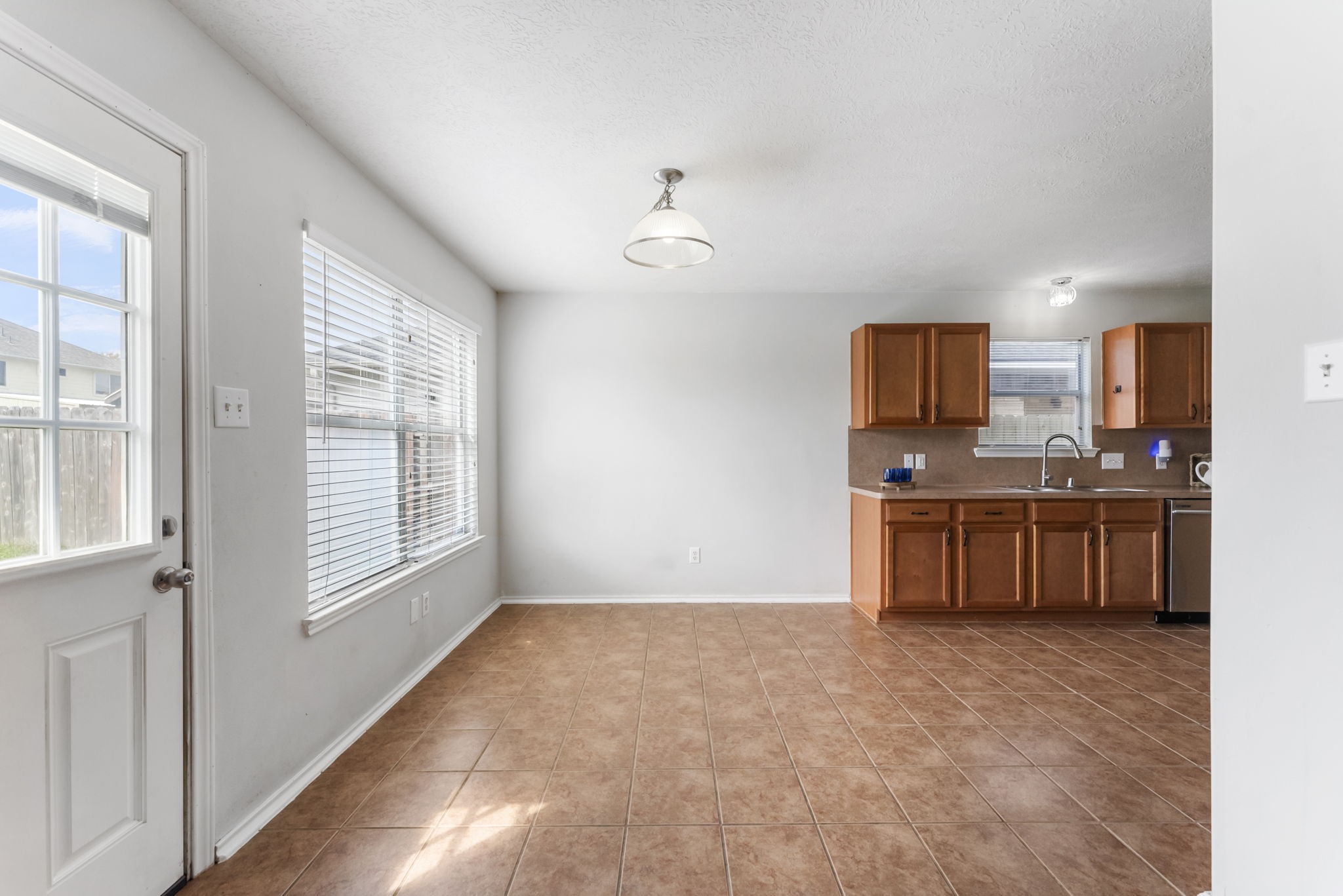 7203 Cool Springs Magnolia, TX 77354 - Photo 31 of 31 a kitchen with stainless steel appliances a refrigerator and a sink