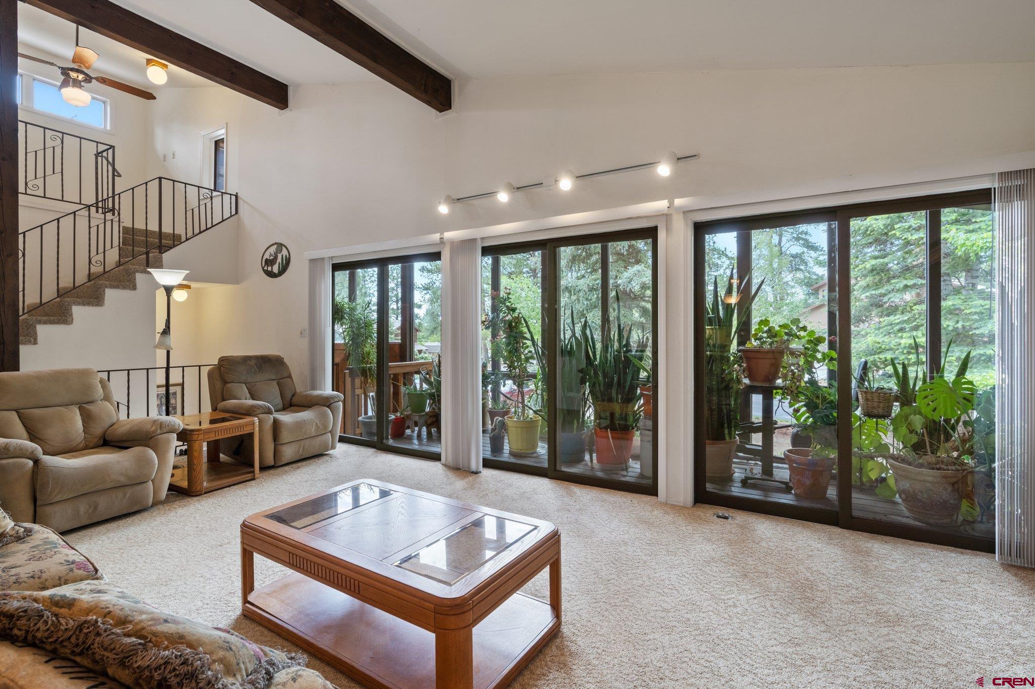 67 Pine Ridge Loop Durango, CO 81301 - Photo 12 of 35 a living room with furniture and a fireplace