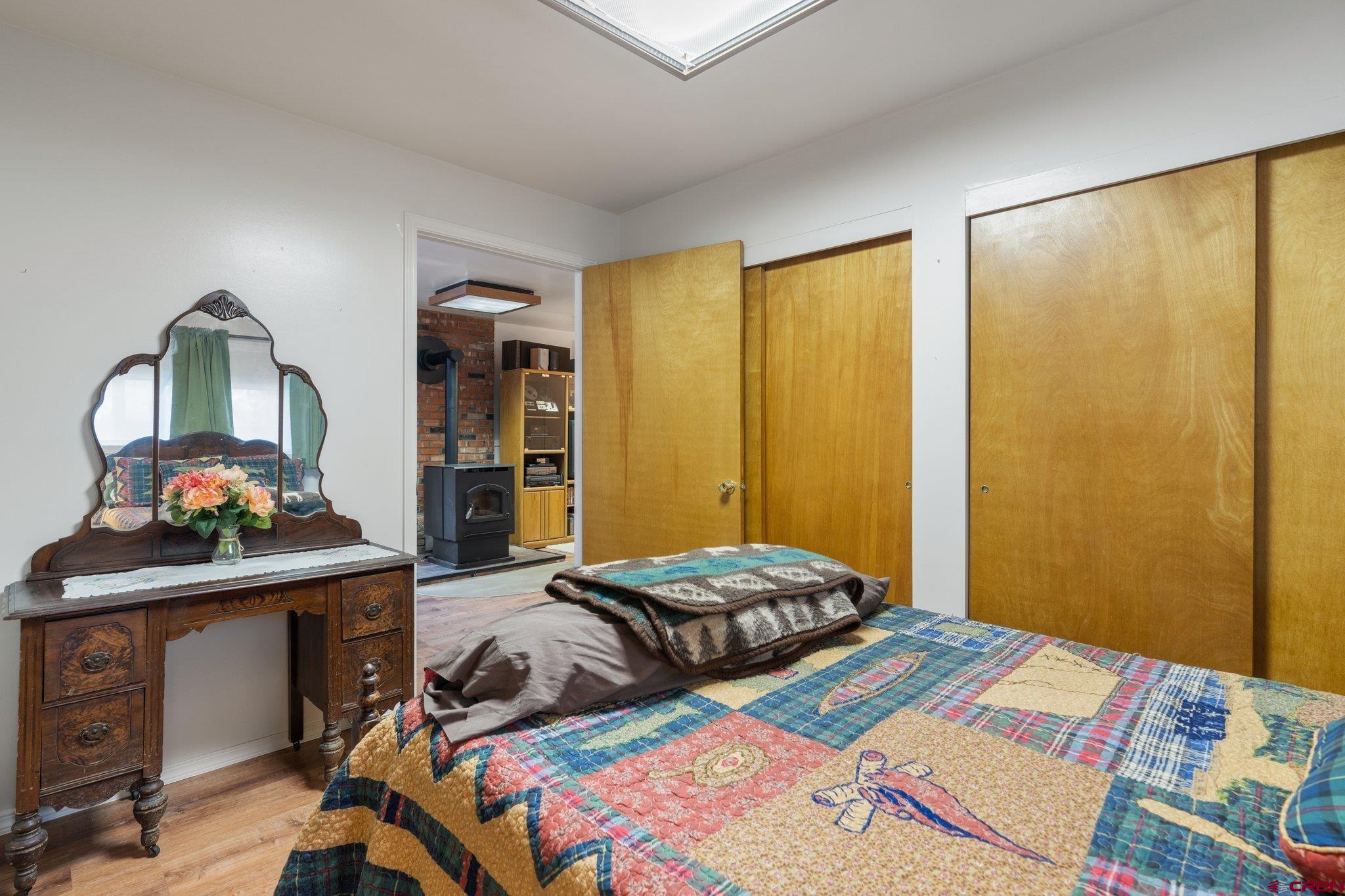 67 Pine Ridge Loop Durango, CO 81301 - Photo 19 of 35 a bedroom with a bed and a dresser