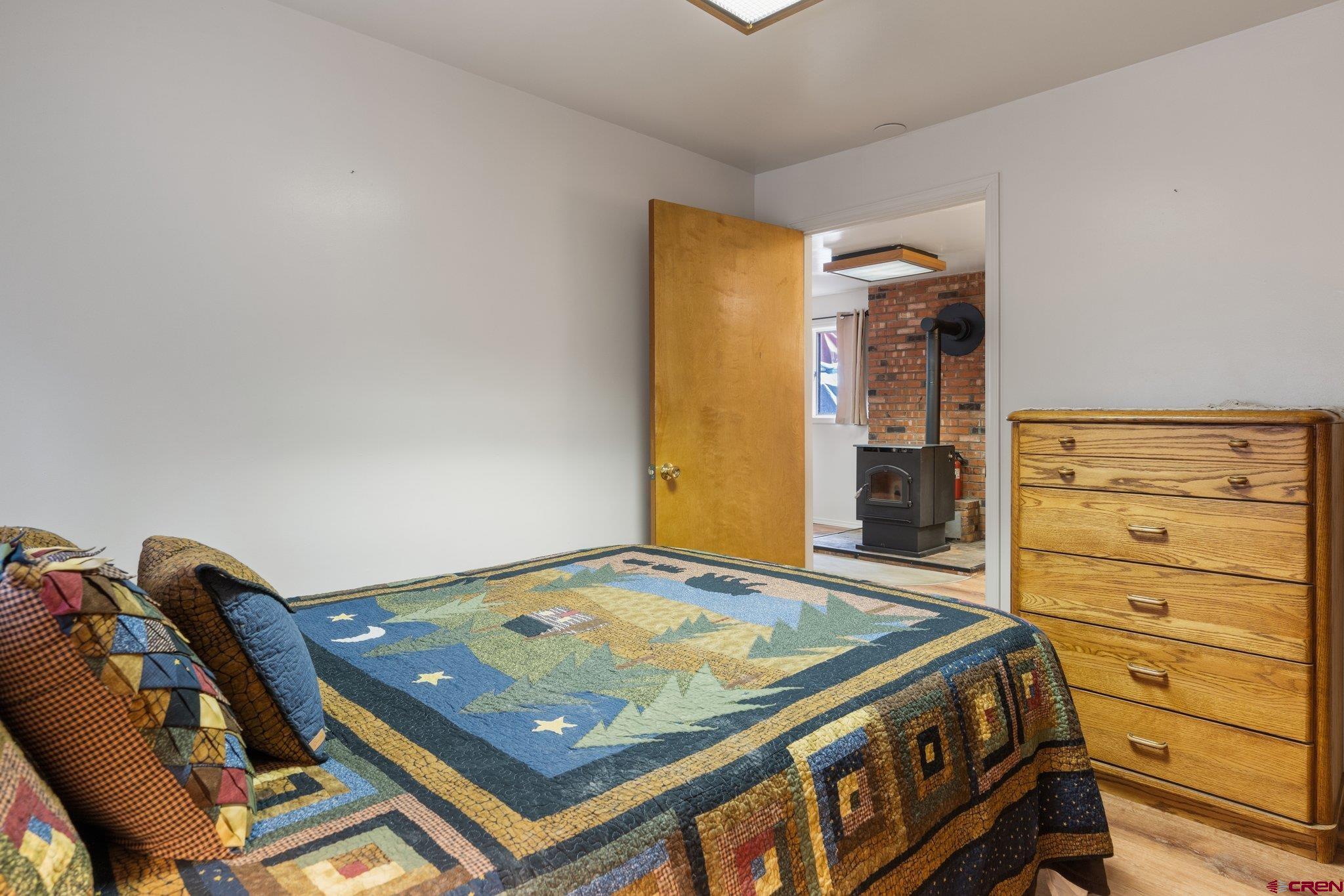 67 Pine Ridge Loop Durango, CO 81301 - Photo 20 of 35 a room with a bed and dresser