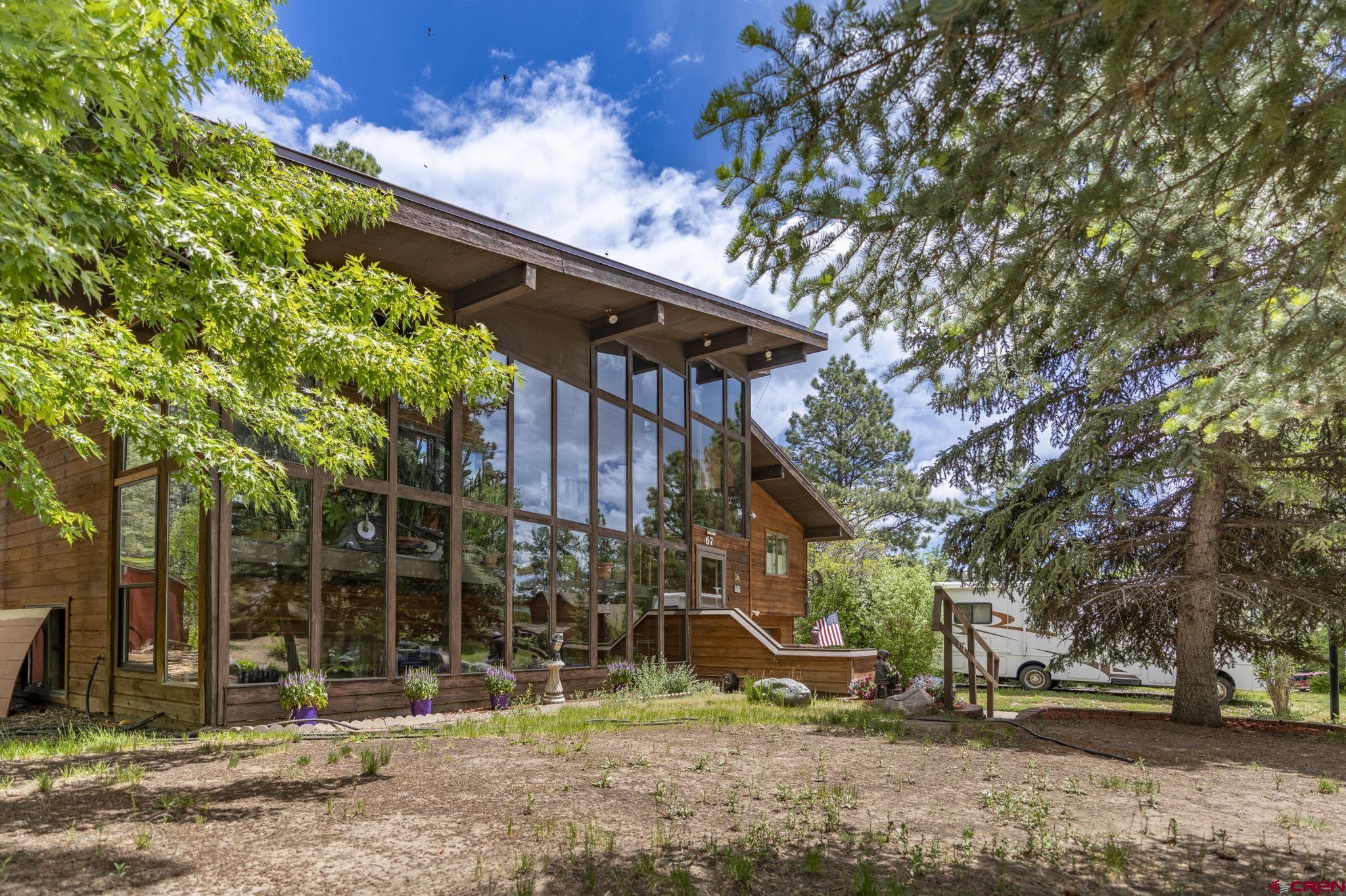 67 Pine Ridge Loop Durango, CO 81301 - Photo 2 of 35 a view of a house with a tree
