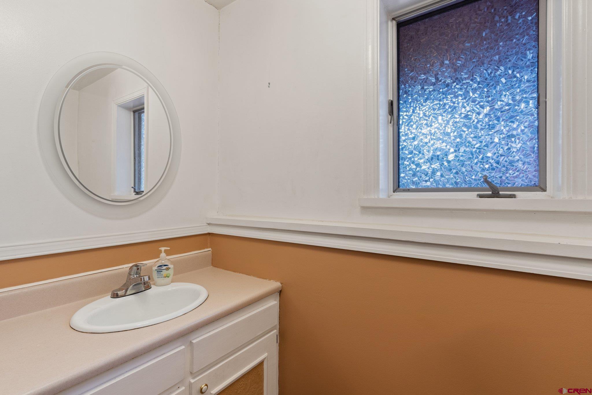 67 Pine Ridge Loop Durango, CO 81301 - Photo 26 of 35 a bathroom with a sink and a mirror