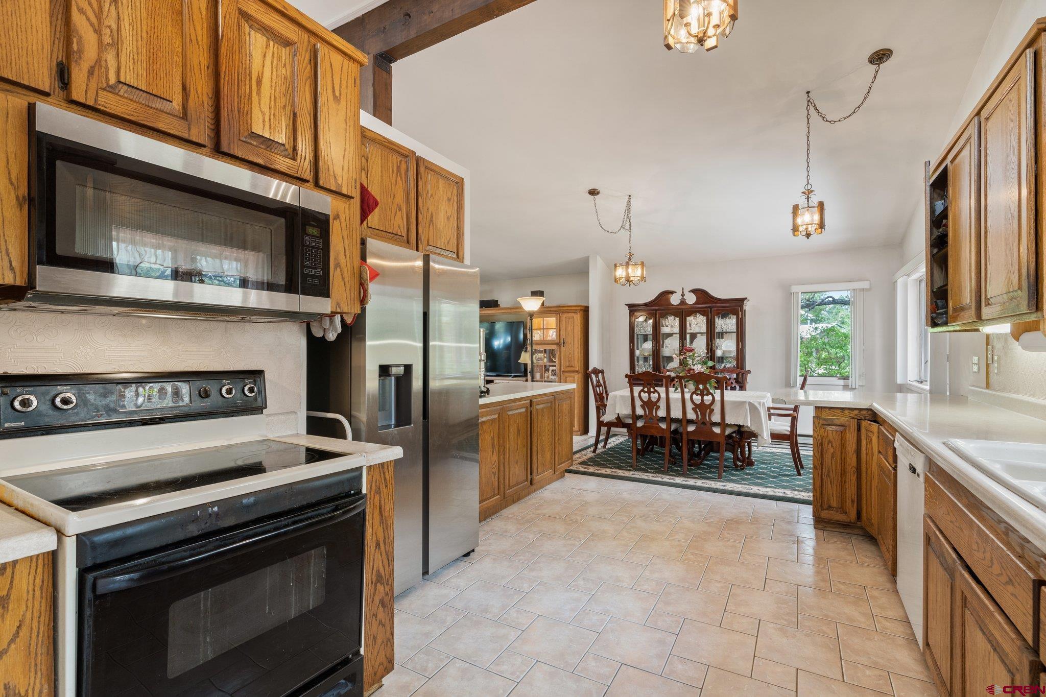 67 Pine Ridge Loop Durango, CO 81301 - Photo 4 of 35 a kitchen with a stove and a microwave