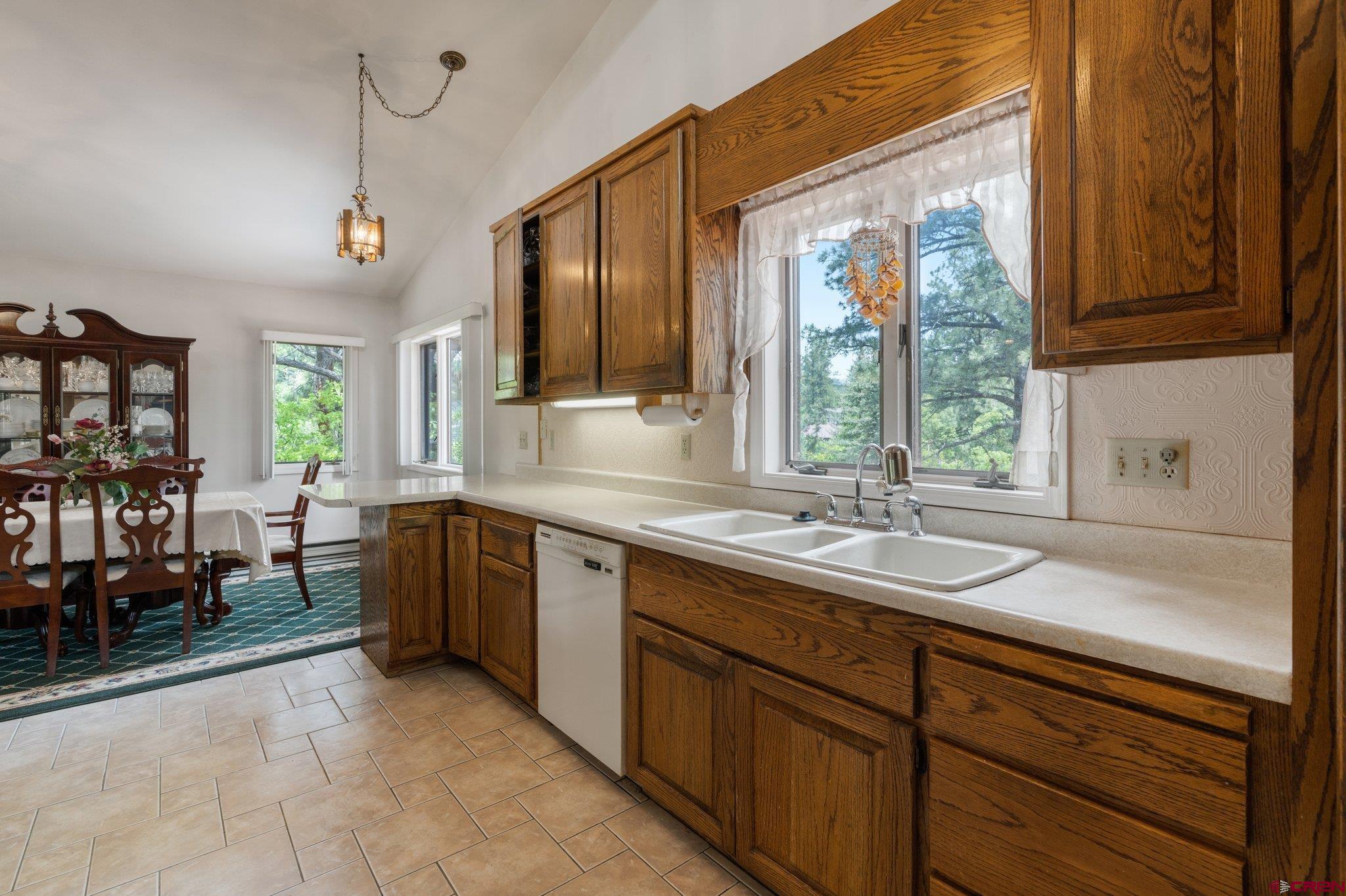 67 Pine Ridge Loop Durango, CO 81301 - Photo 5 of 35 a spacious bathroom with a sink a mirror and next to a window