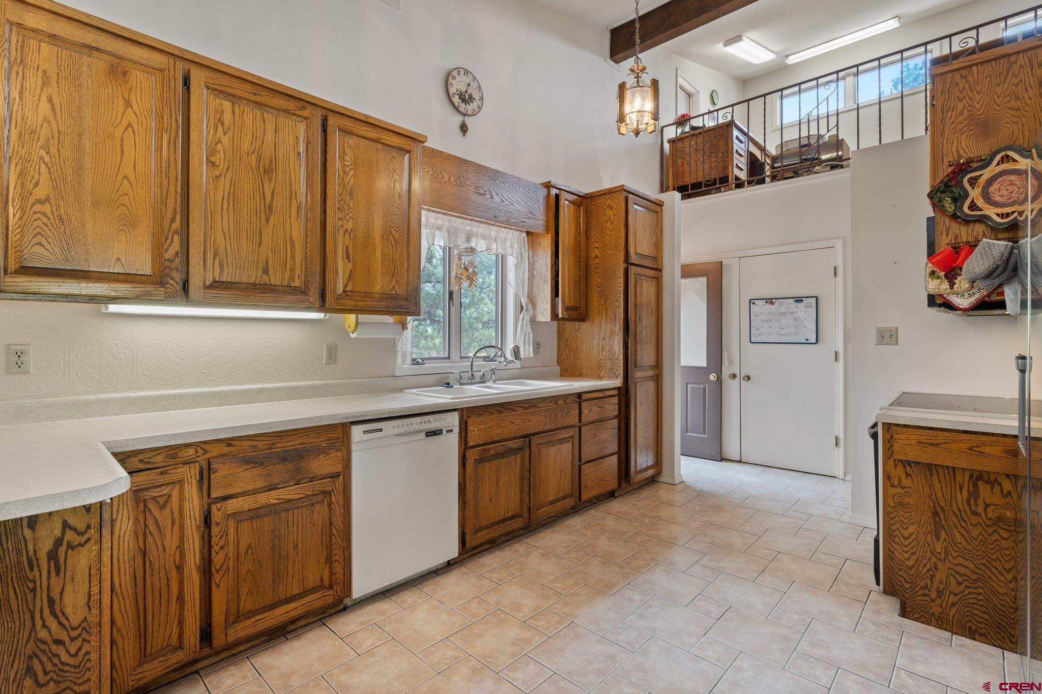 67 Pine Ridge Loop Durango, CO 81301 - Photo 6 of 35 a kitchen with stainless steel appliances granite countertop a refrigerator and a sink