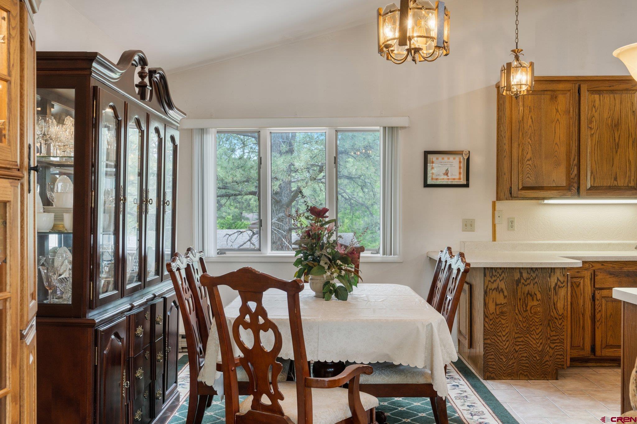 67 Pine Ridge Loop Durango, CO 81301 - Photo 8 of 35 a dining room with furniture and a chandelier