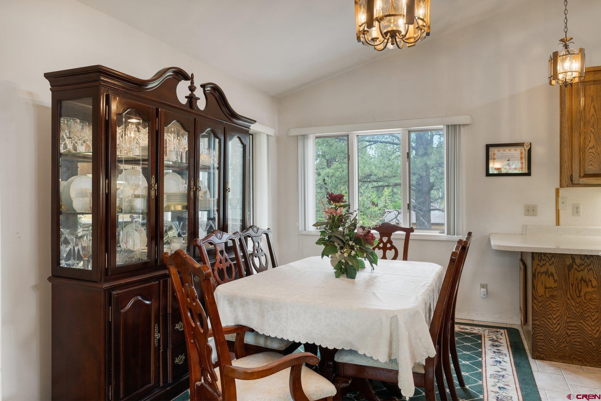 67 Pine Ridge Loop Durango, CO 81301 - Photo 9 of 35 a view of a dining room with furniture window and outside view