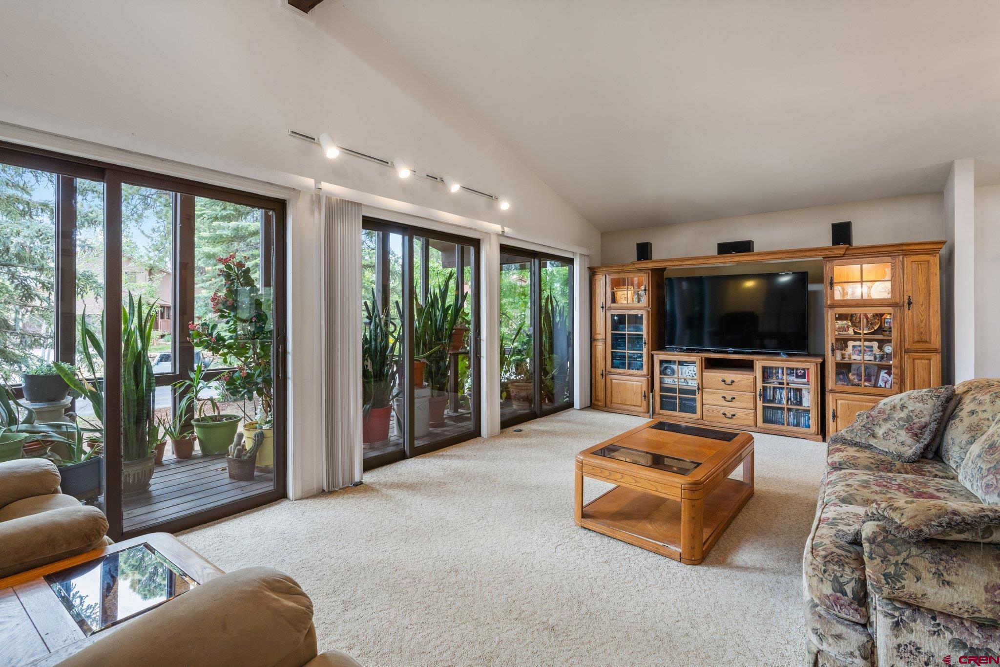 67 Pine Ridge Loop Durango, CO 81301 - Photo 10 of 35 a living room with furniture and a flat screen tv